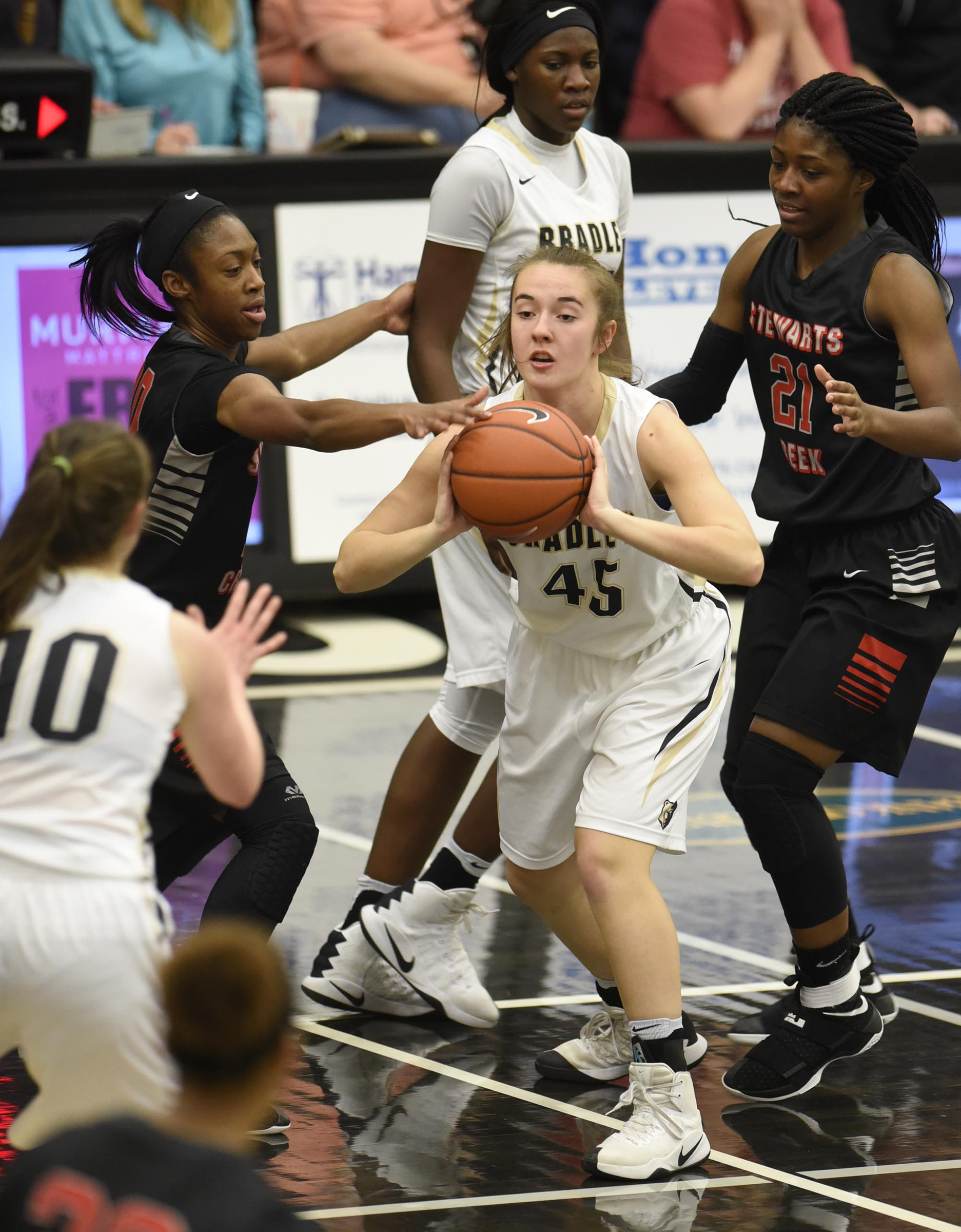 Bradley's Hannah Lombard (45) passes out of trouble to Emma Kate Brown (10). The Stewarts Creek Red Hawks visited the Bradley Central Bears in TSSAA girls sub state basketball action on March 4, 2017.