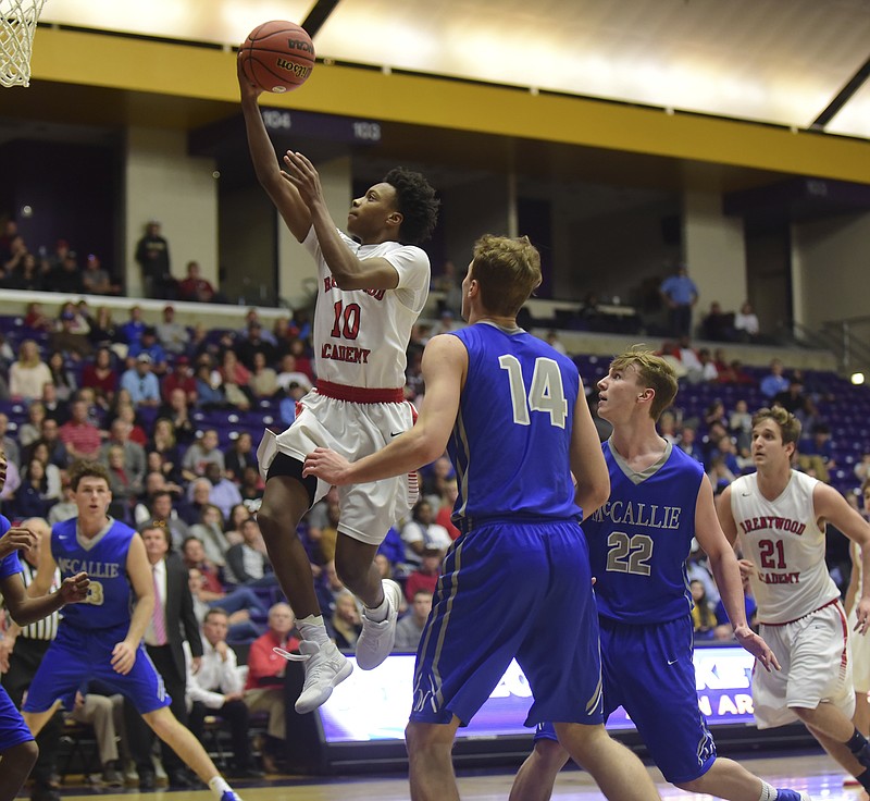 Brentwood Academy's Darius Garland (10) shoots past McCallie School's Seth Clark (14) and Trip Butler (22) during the second half of the Tennessee Division II AA boys' high school basketball championship game Saturday, March 4, 2017, in Nashville, Tenn. (AP Photo/Mike Strasinger)