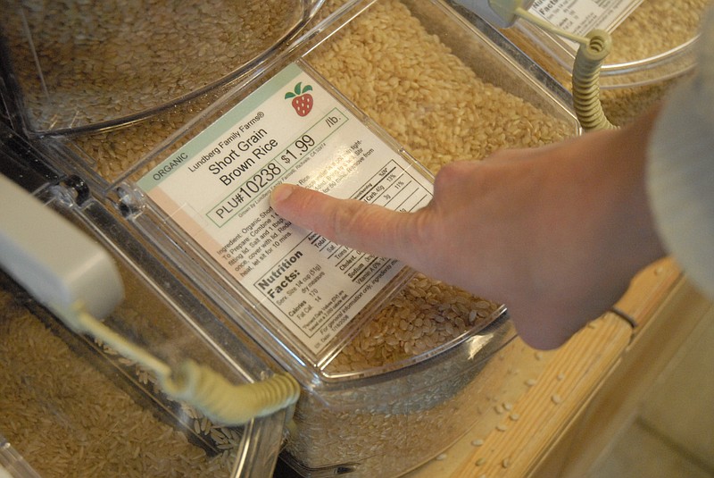 In this 2008 staff file photo, Sherry Gregory purchases some whole grain at Greenlife Grocery.