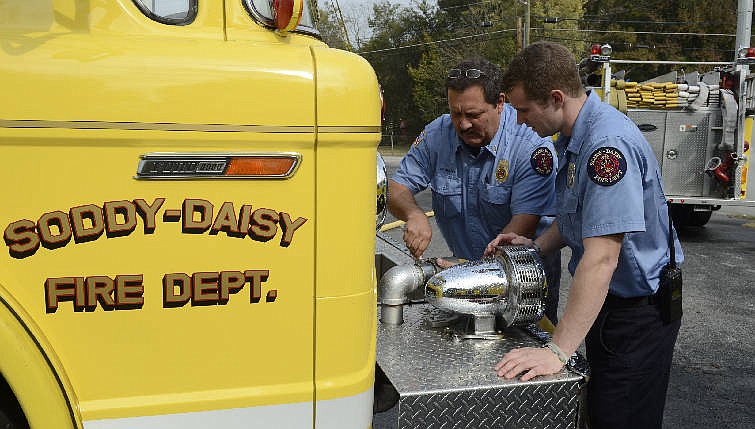 Soddy-Daisy Fire Chief Mike Guffey, left, and firefighter Tyler Stout train at Fire Hall No. 1 in Soddy-Daisy. People who have donated funds for the construction of Fire Hall No. 3 on the south end of the city are concerned that the project has yet to get off the ground.
