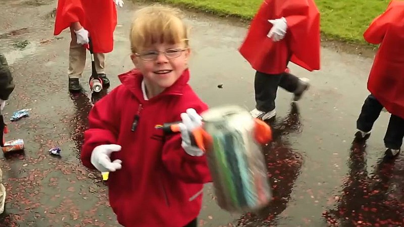 A young participant during last year's Sparkle Day helps clean up litter on the mountain.