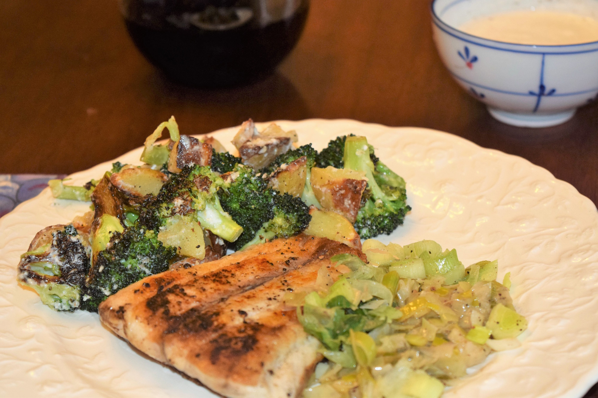 Crispy Barramundi (Sea Bass) with Melted Leeks and Roasted Vegetables is one of Blue Apron's favorite meal selections.