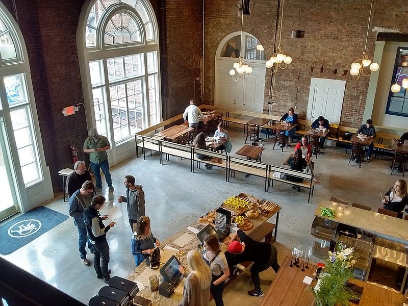 Customers lined up at lunchtime Mondy at frothy monkey, a new eatery just inside the main lobby of the historic Choo Choo hotel.