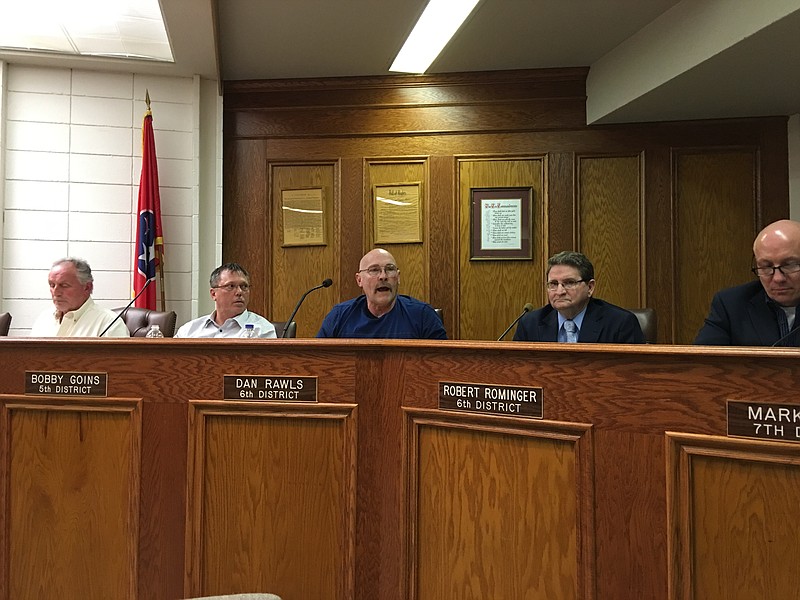 Bradley County Commissioner Dan Rawls, center, voices opposition to proposed fuel tax hikes, while commissioners Howard Thompson, Bobby Goins, Robert Rominger and Mark Hall listen.