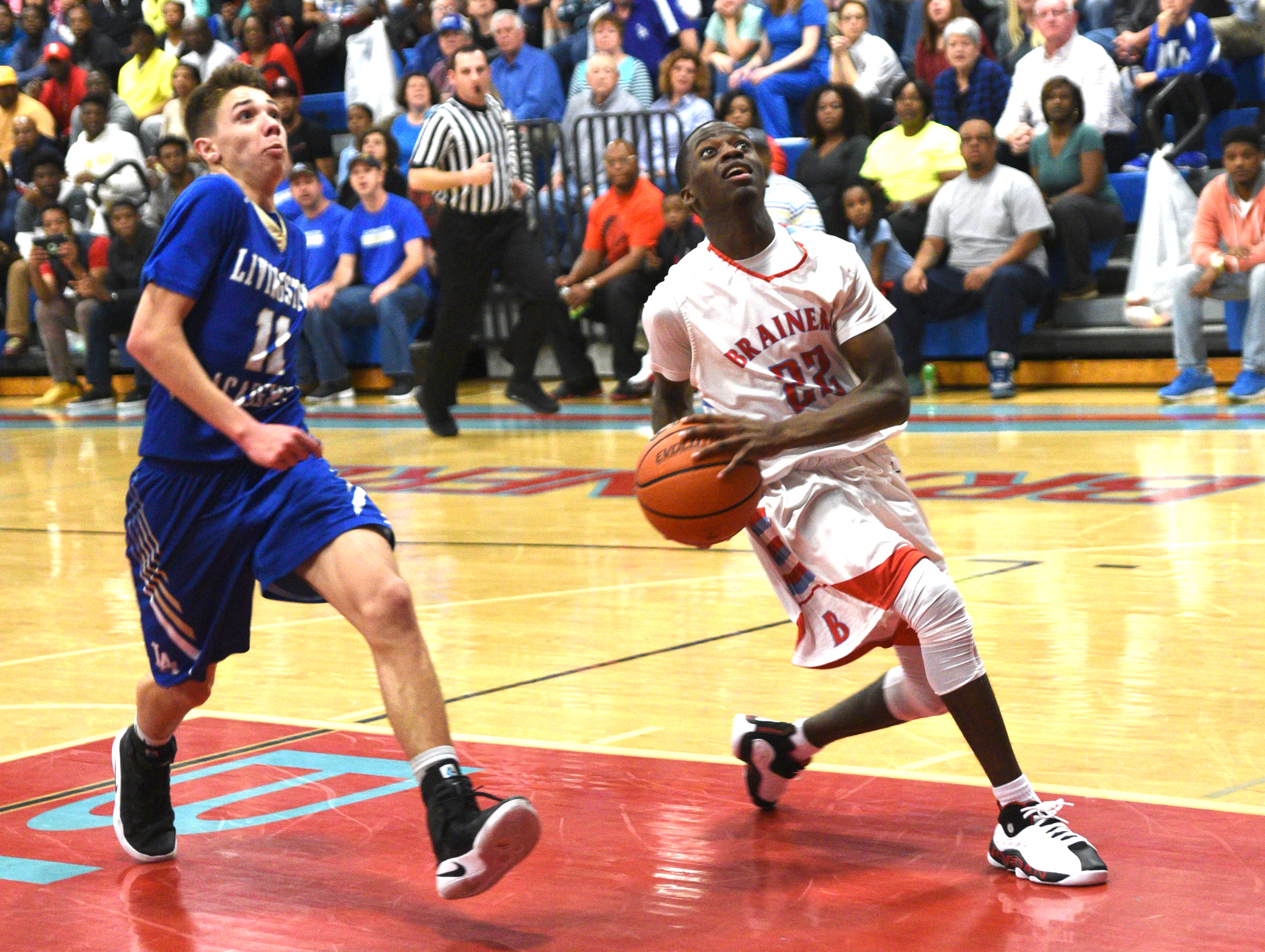 Brainerd's Malik Hampton is guarded by Livingston's Cody Ray Monday, March 6, 2017 at Brainerd High School.