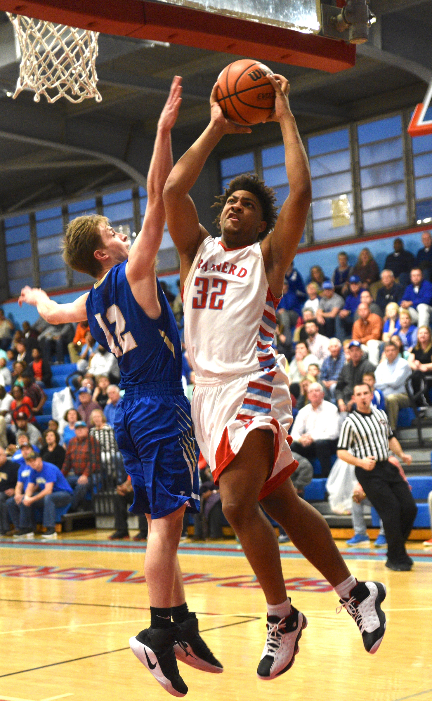 Brainerd's Jessie Walker takes a shot as Livingston's Xander Miller Monday, March 6, 2017 at Brainerd High School.