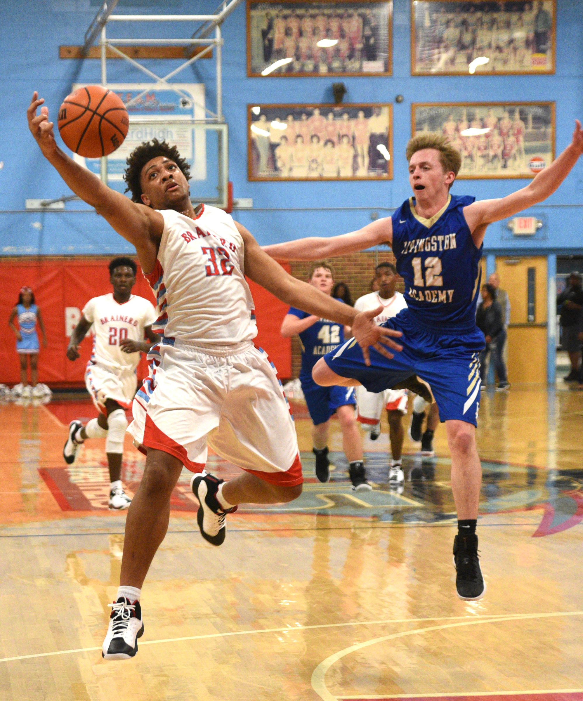 Brainerd's Jessie Walker snags a pass as Livingston's Xander Miller guards Monday, March 6, 2017 at Brainerd High School.