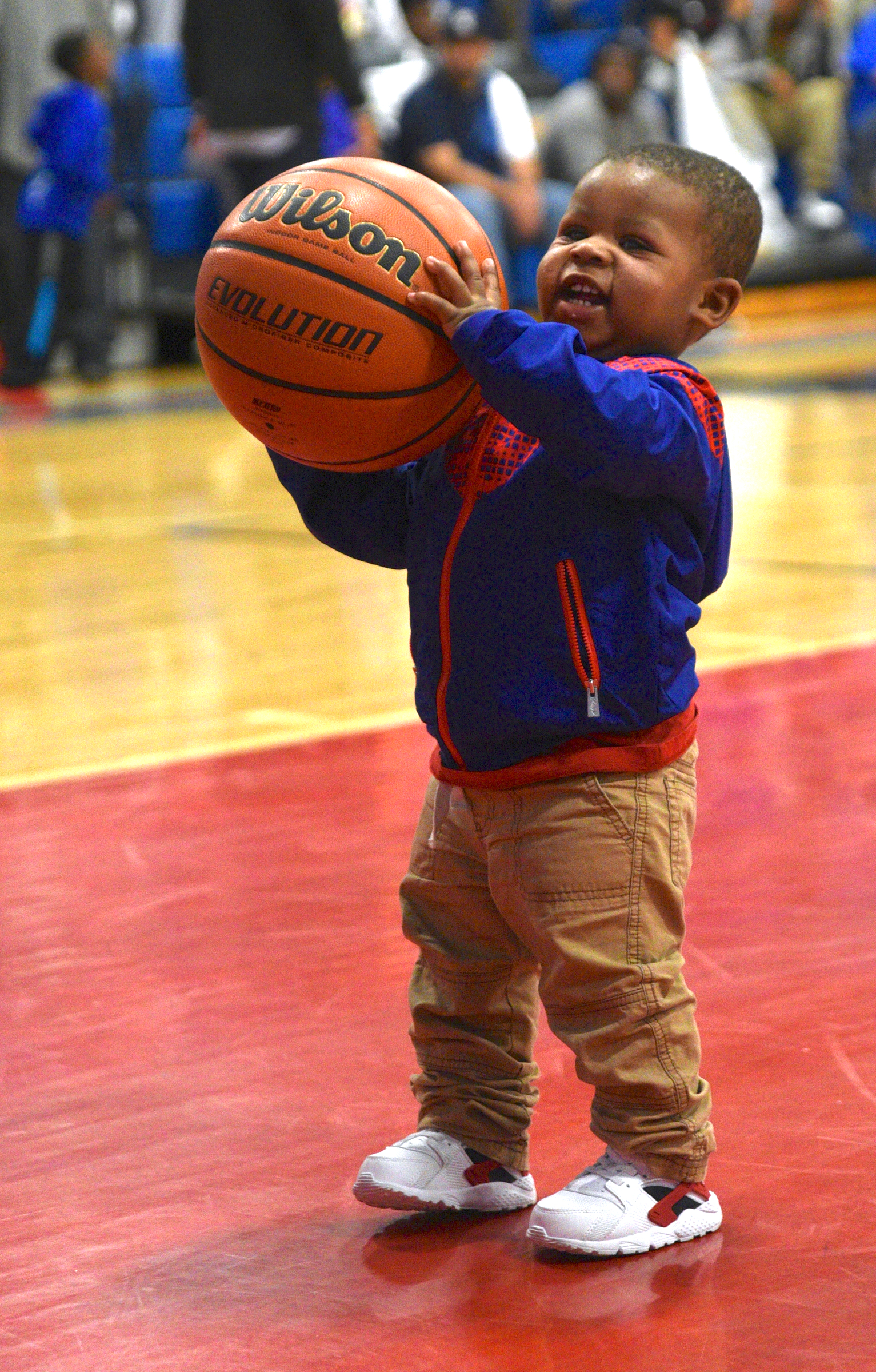 Young Brainerd fan, Makhi Tipton, plays on the court at half time of the game against Livingston Monday, March 6, 2017 at Brainerd High School.
