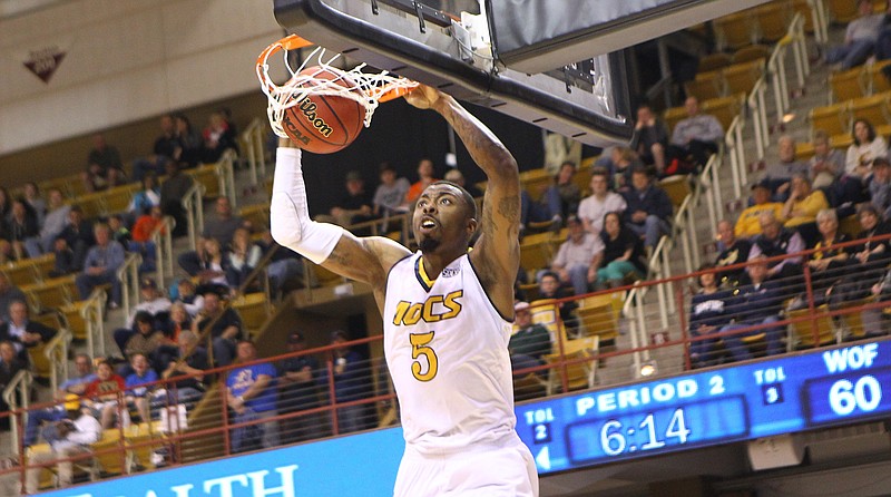 UTC's Justin Tuoyo slam dunks during the Mocs' 79-67 loss to Wofford on Saturday, March 4, 2017.