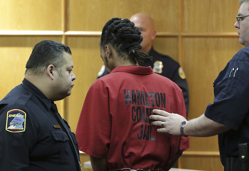 Johnthony Walker, the driver involved in the November 21, 2016 school bus crash that sent 31 of the 37 students on board to the hospital resulting in six fatalities, is escorted out of Judge Lila Statom's courtroom in Hamilton County General Sessions Court on December 15, 2016 for charges of vehicular homicide, reckless endangerment and reckless driving. WalkerÕs case was bound over to the grand jury after an hour and a half of testimony from two Chattanooga Police Department officers.