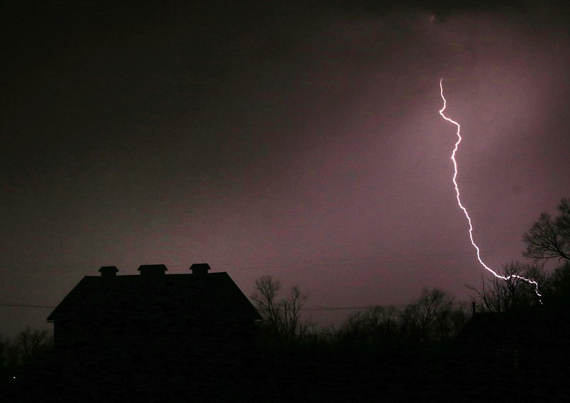 
              Lightning strikes near the barn on the Taylor farm near Lawrence, Kan., Monday, March 6, 2017. The area fell under a severe thunderstorm warning at the time. (AP Photo/Orlin Wagner)
            