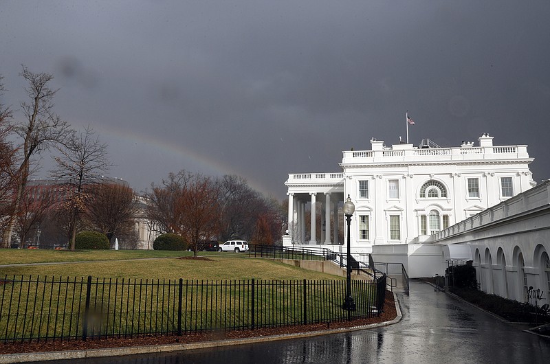 
              FILE - In this Saturday, Feb. 25, 2017, file photo, a rainbow is seen next to the White House as a cold front passes through the area in Washington. The White House is staffing up its team of lawyers as it prepares for a complicated mix of ethics issues and policy fights ahead. (AP Photo/Alex Brandon, File)
            