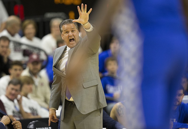 Kentucky head coach John Calipari yells to his team during the first half of an NCAA college basketball game against Texas A&M, Saturday, March 4, 2017, in College Station, Texas. (AP Photo/Sam Craft)