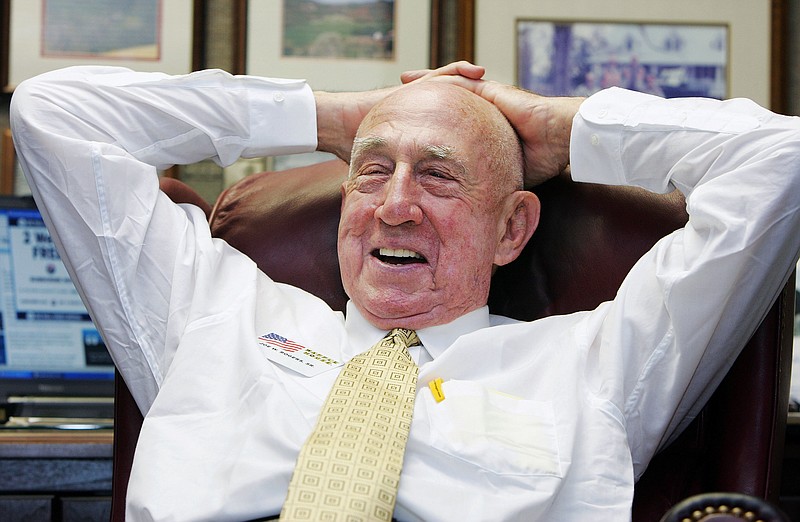 FILE - In this Tuesday, July 26, 2005, file photo, Waffle House co-founder Joseph Wilson Rogers Sr., sits in his office in the Waffle House headquarters in Norcross, Ga. Georgia-based Waffle House said Rogers died Friday, March 3, 2017. He was 97. (AP Photo/Ric Feld, File)