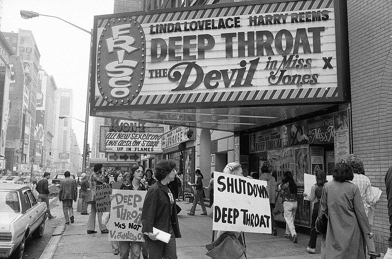 In this May 31, 1980 file photo, protesters picket the theater where the film "Deep Throat" is being shown. 