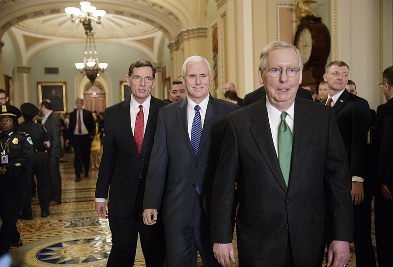
              Vice President Mike Pence, center, smiles as he joins Senate Majority Leader Mitch McConnell, R-Ky., right, and Sen. John Barrasso, R-Wyo., left, to speak with reporters about the Republican plan to replace Obamacare, Tuesday, March 7, 2017, on Capitol Hill in Washington. (AP Photo/J. Scott Applewhite)
            