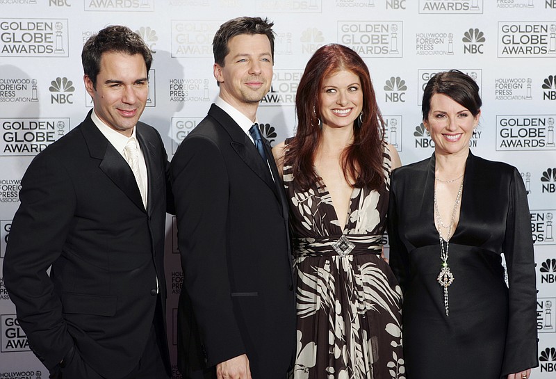 
              FILE - In this Jan. 16, 2006, file photo, cast members from the comedy series "Will & Grace," from left, Eric McCormack, Sean Hayes, Debra Messing and Megan Mullally, pose backstage after making an award presentation at the 63rd Annual Golden Globe Awards in Beverly Hills, Calif. The stars of "Will & Grace" gave fans a behind the scenes glimpse at production of the series’ revival on the weekend of March 5, 2017. (AP Photo/Reed Saxon, File)
            