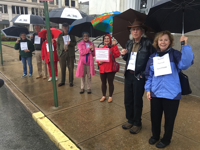 Margaret Jackson-Hill stands with eight other Chattanoogans to protest a proposal by Congressional Republicans to defund Planned Parenthood on Tuesday, March 7, 2017.