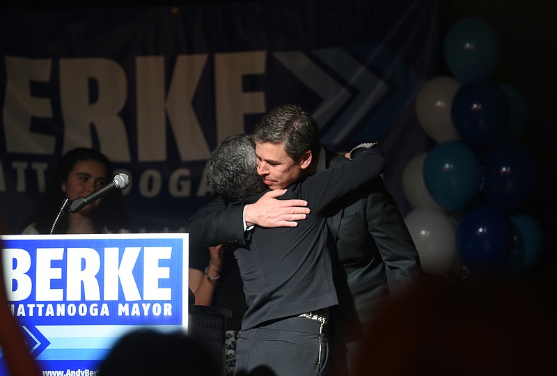 Staff photo by Angela Lewis Foster Mayor Andy Berke gives wife, Monique, a hug before speaking to supporters Tuesday, March 7, 2017 in the Revelry Room.