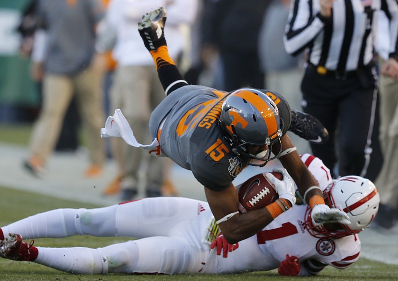 Tennessee wide receiver Jauan Jennings leaps over Nebraska's Lamar Jackson during the Vols' 38-24 Music City Bowl win this past December. Jennings had a breakout season last year but will be counted on to provide more leadership in 2017.