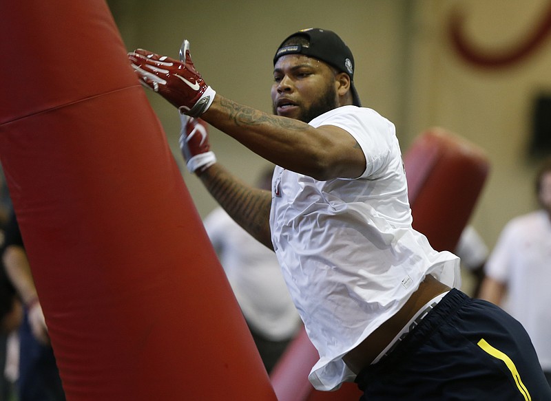 Former Alabama outside linebacker Ryan Anderson works out in front of NFL representatives during Wednesday's Pro Day at the Hank Crisp Indoor Facility in Tuscaloosa.