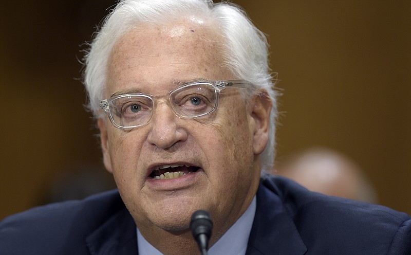 
              FILE - In this Feb. 16, 2017 file photo, U.S. Ambassador Israel-designate David Friedman testifies on Capitol Hill in Washington at his confirmation hearing before the Senate Foreign Relations Committee. The committee narrowly approved Friedman's nomination, Thursday, March 9, 2017.  (AP Photo/Susan Walsh, File)
            