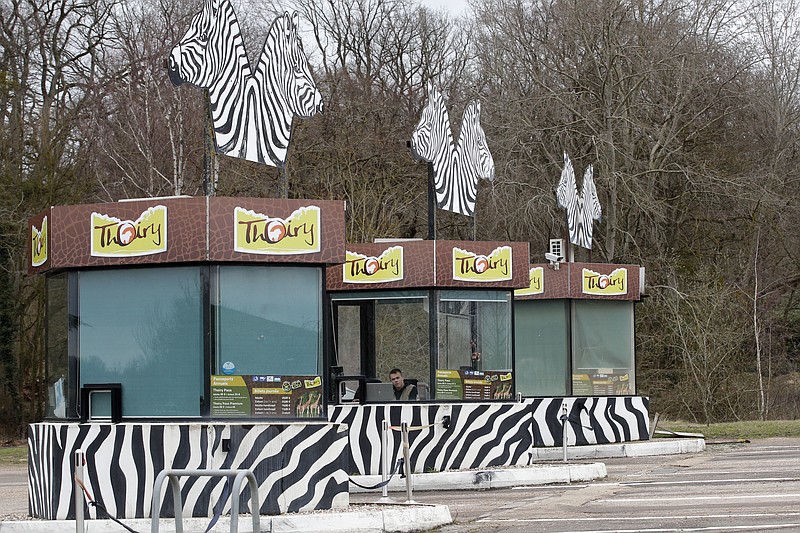 
              View of the entrance of the Thoiry Zoo, near Paris, France, Wednesday, March 8, 2017, where a rhinoceros named Vince was killed and one of it's horns removed using a chain saw. A zoo director says a 5-year-old rhinoceros at the wildlife park he runs near Paris, had been shot three times in the head by assailants who stole the animal's horn, it's carcass being found Tuesday. (AP Photo/Christophe Ena)
            