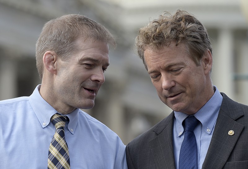 
              Rep. Jim Jordan, R-Ohio, left, talks with Sen. Rand Paul, R-Ky. during a news conference on health care, Tuesday, March 7, 2017, on Capitol Hill in Washington. (AP Photo/Susan Walsh)
            