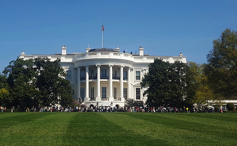 
              FILE - In this April 17, 2016 file photo, people visit the south lawn during the annual White House Spring Garden tours in Washington. The U.S. Secret Service says a person is under arrest after climbing a fence and getting onto the south grounds of the White House. The breach happened at about 11:38 p.m. Friday, March 10, 2017.  President Donald Trump was at the White House.  (AP Photo/Estelle Doro)
            