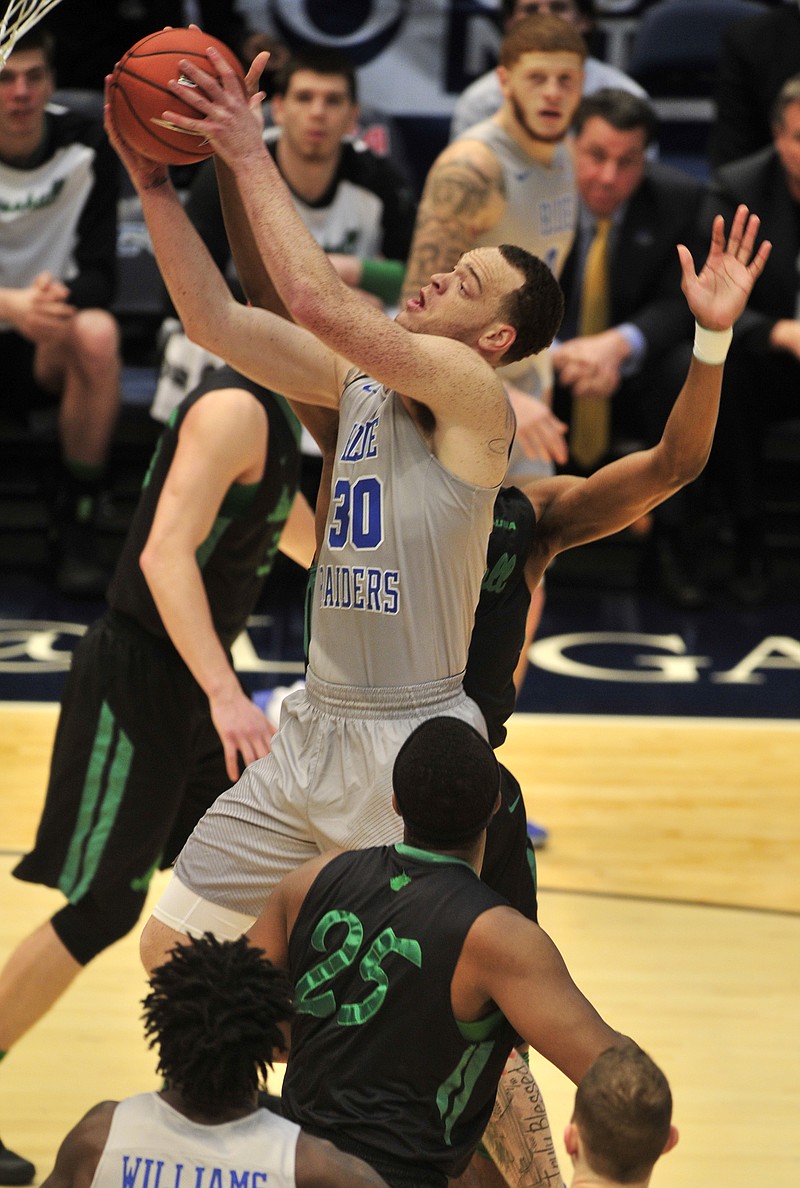 Middle Tennessee (30) Reggie Upshaw, Jr. shoots a layup in the first half against Marshall in the NCAA college basketball game during the championship game of the Conference USA tournament, Saturday, March 11, 2017, in Birmingham, Ala. (AP Photo/Eric Schultz)

