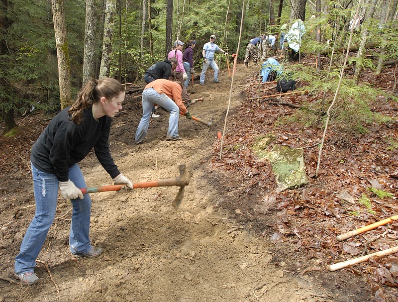 College students from dozens of universities spend their spring break working to build sections of the Cumberland Trail on the plateau near Barker Camp Road in 2011. Officials are hoping to find new volunteers to help maintain the trail. 