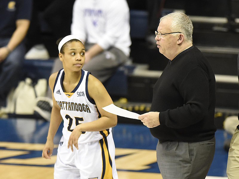 UTC guard Chelsey Shumpert awaits instructions from coach Jim Foster during a home game against Samford last month. The Mocs will learn their seed and first-round destination for the NCAA tournament tonight.