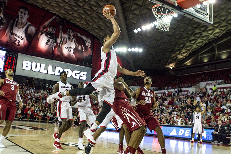 Georgia junior guard Juwan Parker shoots over the Alabama defense during a January game at Stegeman Coliseum. The Bulldogs and Crimson Tide were invited Sunday night to the NIT.