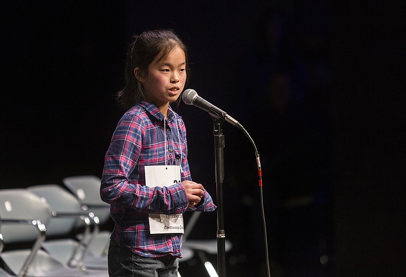 Lisa Lin spells a word during the Times Free Press Regional Spelling Bee at the UTC Fine Arts Center on Saturday, March 11, 2017, in Chattanooga, Tenn. Thrasher Elementary student Lin won first place and will represent Chattanooga in the national spelling bee.
