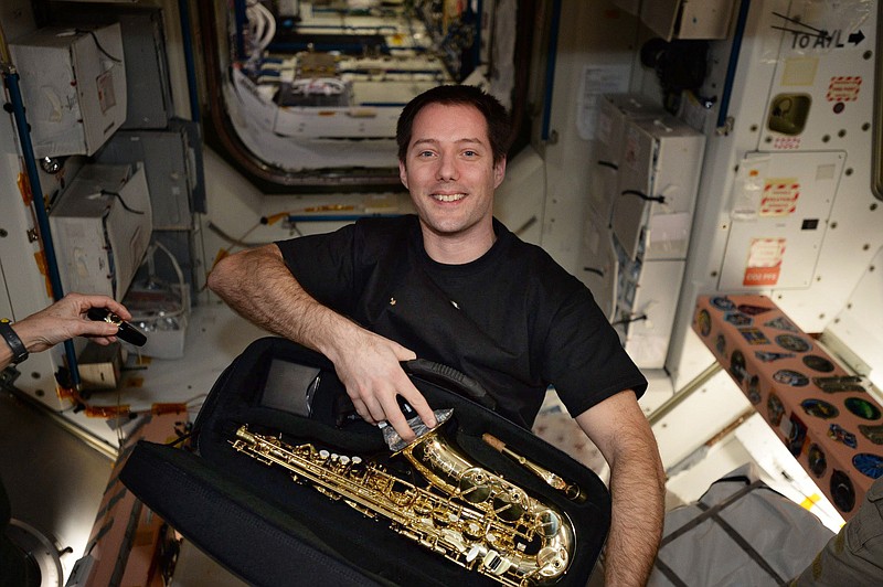 
              This image posted by French astronaut Thomas Pesquet on Twitter on March 12, 2017, shows him with a saxophone he received for his birthday aboard the International Space Station. The instrument arrived in a SpaceX cargo ship on Feb. 23, and his crewmates kept it hidden until his 39th birthday on Feb. 27. (Courtesy Thomas Pesquet via AP)
            