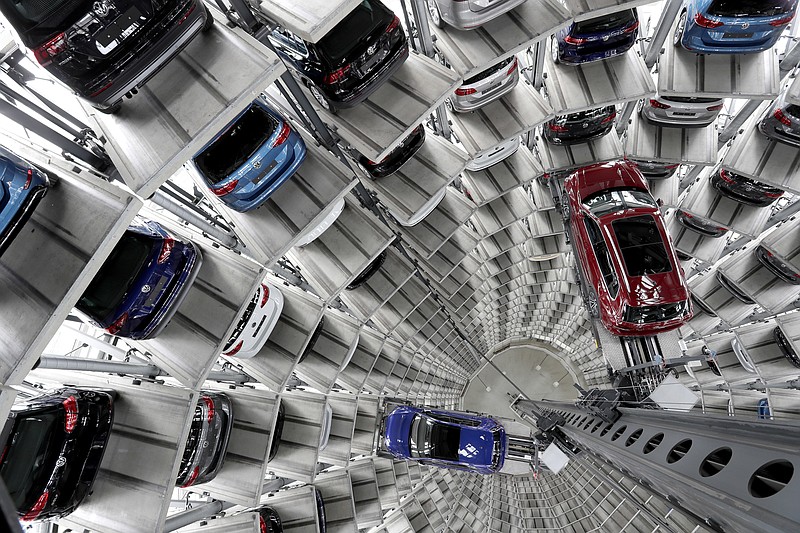 Volkswagen cars are lifted inside a delivery tower of the company in Wolfsburg, Germany, Tuesday, March 14, 2017. The CEO of German automaker Volkswagen says the United States remains a "core market" for the company despite its diesel emissions scandal and has underlined that it hopes to expand there. Matthias Mueller made the comments Tuesday at the company's annual news and investor conference at its headquarters in Wolfsburg, Germany. (AP Photo/Michael Sohn)