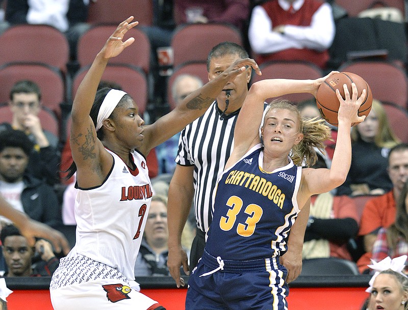 UTC's Lakelyn Bouldin looks for help while under defensive pressure from Louisville's Myisha Hines-Allen during their game at Louisville in November. Louisville won 63-47, but the Mocs will get a second shot at the Cardinals in the first round of the NCAA tournament Saturday.