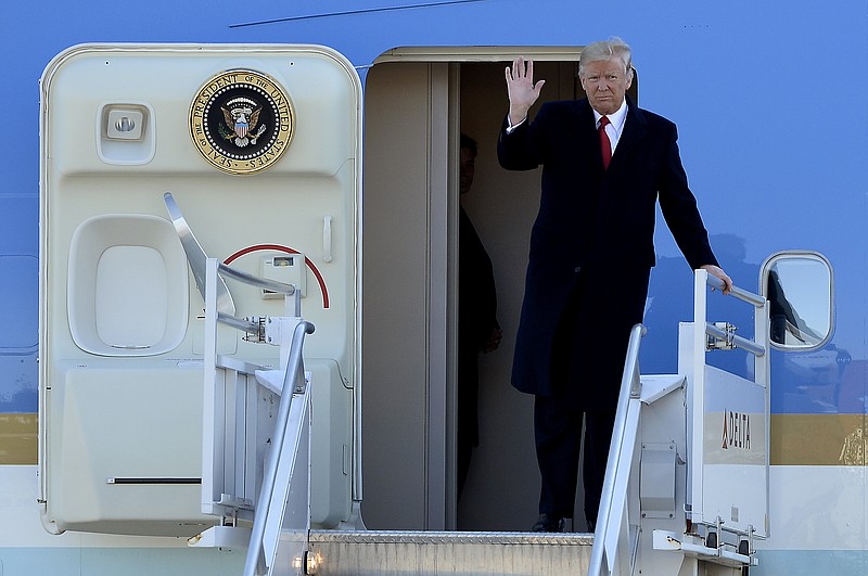 President Donald Trump waves as he gets off Air Force One Wednesday, March 15, 2017, in Nashville, Tenn. Trump is scheduled to visit the home of President Andrew Jackson and later in the day speak about health care at a rally. (AP Photo/Mark Zaleski)