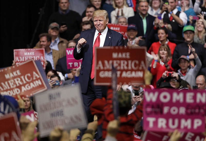 President Donald Trump acknowledges applause as he leaves the stage after speaking at a rally Wednesday, March 15, 2017, in Nashville, Tenn. (AP Photo/Mark Humphrey)

