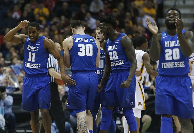 Middle Tennessee State players react during the second half of an NCAA college basketball tournament first round game against Minnesota Thursday, March 16, 2017, in Milwaukee. (AP Photo/Kiichiro Sato)