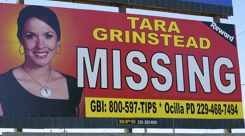 FILE - In this Wednesday, Oct. 4, 2006, file photo, missing teacher Tara Grinstead is displayed on a billboard in Ocilla, Ga. News organizations are challenging a judge's gag order in a case involving the slaying of Grinstead. (AP Photo/Elliott Minor, File)

