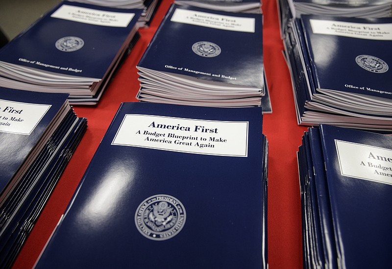 Copies of President Donald Trump's first budget are displayed at the Government Printing Office in Washington, Thursday, March, 16, 2017. Trump unveiled a $1.15 trillion budget on Thursday, a far-reaching overhaul of federal government spending that slashes many domestic programs to finance a significant increase in the military and make a down payment on a U.S.-Mexico border wall. (AP Photo/J. Scott Applewhite)

