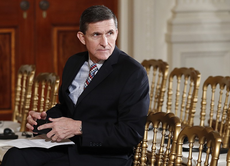 
              FILE - In this Feb. 10, 2017 file photo, then-National Security Adviser Michael Flynn sits in the East Room of the White House in Washington. Documents released in a congressional inquiry show Flynn was paid more than $33,750 by RT, Russia’s government-run television system, for appearing at a Moscow event in December 2015. Flynn had retired months earlier as head of the U.S. Defense Intelligence Agency. (AP Photo/Carolyn Kaster, File)
            