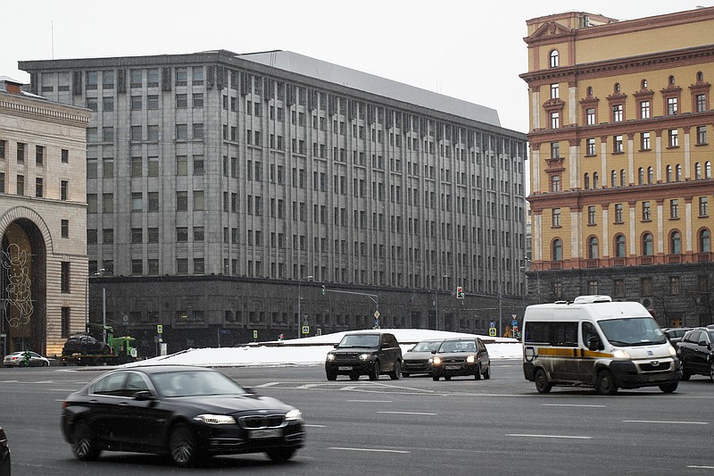 FILE - In this Friday, Dec. 30, 2016 file cars pass the FSB headquarters in downtown Moscow, Russia. (AP Photo/Alexander Zemlianichenko, file)