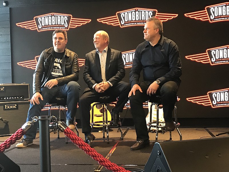 Musician Vince Gill, left, is the ambassador for Songbirds Guitar Museum. He was joined by Curator David Davidson and President Johnny Smith during a news conference March 9 to mark the venue's grand opening.
