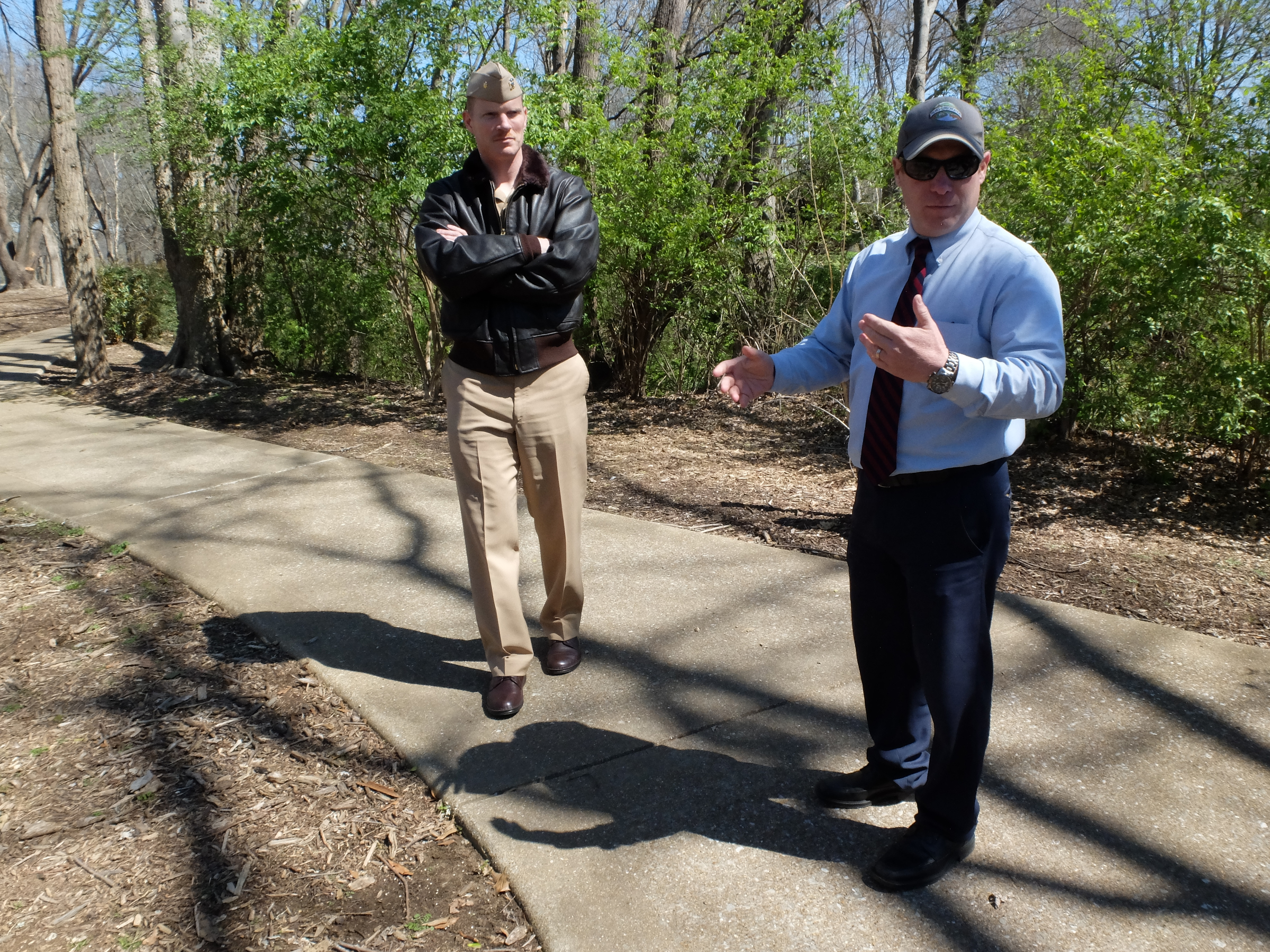 Lt. Cmdr Tim White, left, and Hamilton County Parks and Recreation Director Tom Lamb survey the possible location for a permanent July 16 memorial at the Tennessee Riverpark.