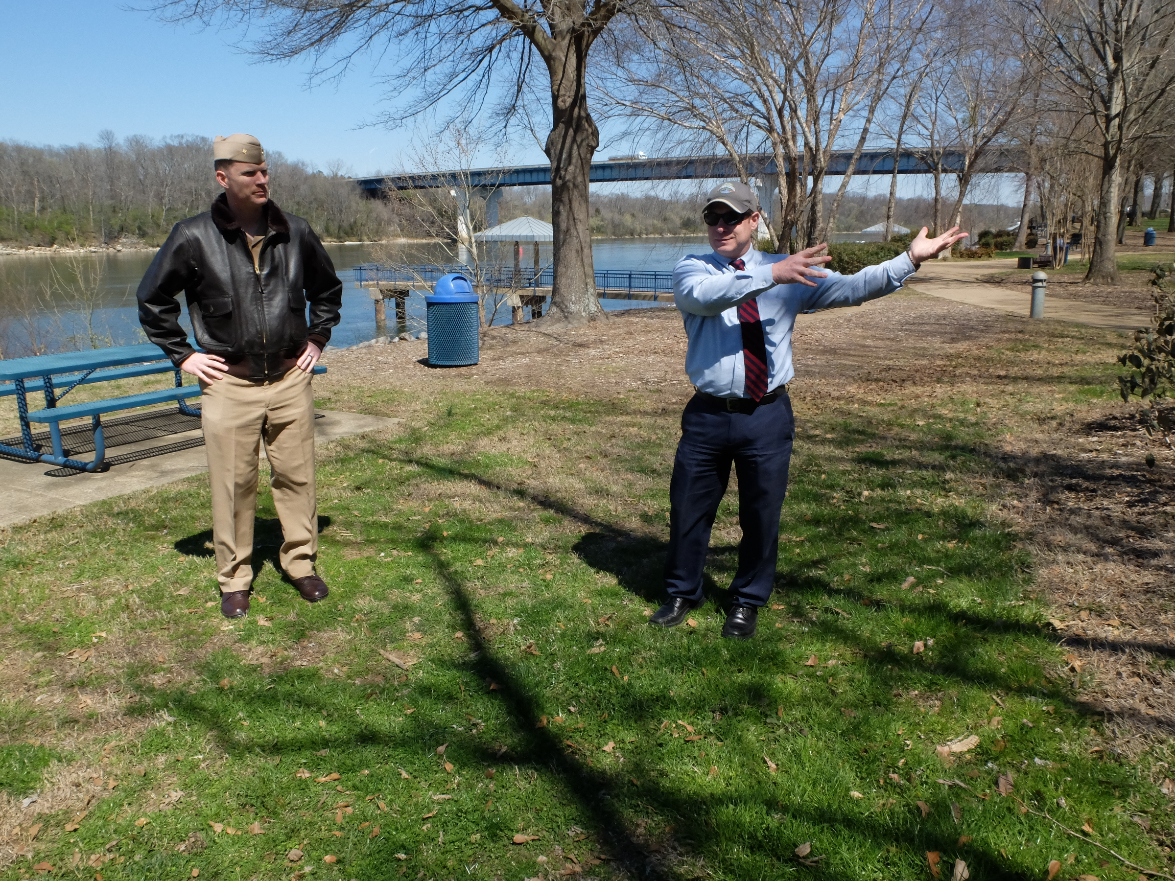 Lt. Cmdr Tim White, left, and Hamilton County Parks and Recreation Director Tom Lamb survey the possible location for a permanent July 16 memorial at the Tennessee Riverpark.