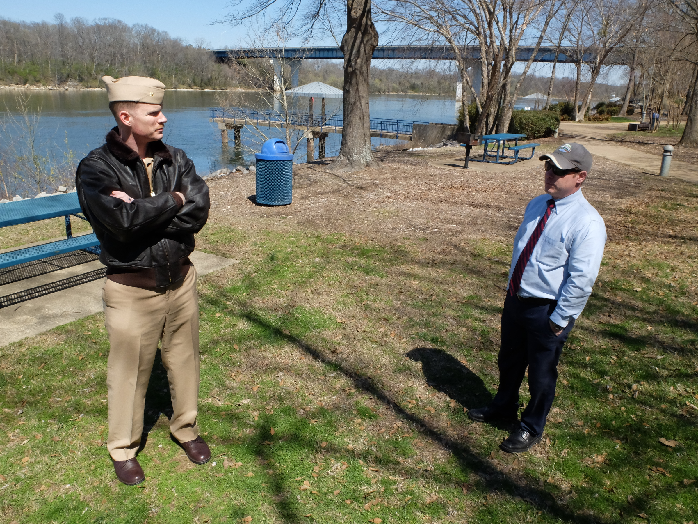 Lt. Cmdr Tim White, left, and Hamilton County Parks and Recreation Director Tom Lamb survey the possible location for a permanent July 16 memorial at the Tennessee Riverpark.