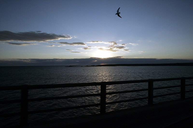 
              FILE - In a June 30, 2005 file photo, Michigan's Upper Peninsula and Lake Michigan is seen from the Mackinac Bridge in Mackinaw City, Mich. President Donald Trump wants to eliminate federal support of a program that addresses the Great Lakes' most pressing environmental threats. Trump's 2018 budget released Thursday, March 16, 2017, would remove all funding for the Great Lakes Restoration Initiative, which has received strong support from members of Congress in both parties since President Barack Obama established it in 2009. (AP Photo/Carlos Osorio, File)
            