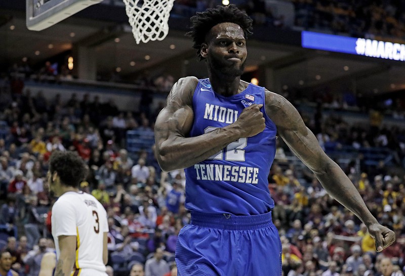 
              Middle Tennessee State's JaCorey Williams celebrates during the second half of an NCAA college basketball tournament first round game against Minnesota Thursday, March 16, 2017, in Milwaukee. Middle Tennessee State won 81-72. (AP Photo/Morry Gash)
            